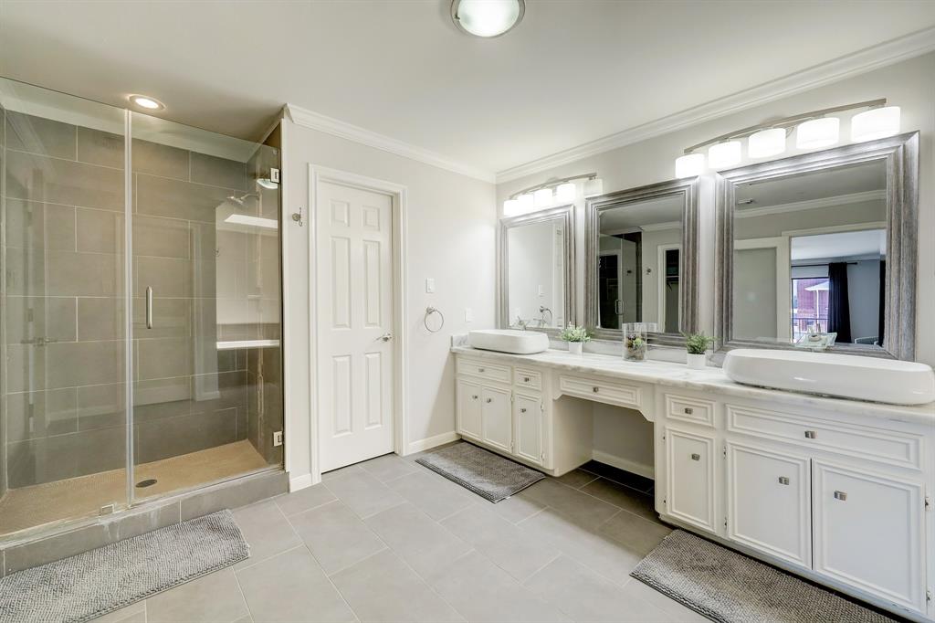 The primary bath also features a separate shower with plenty of space, as well as a water closet.