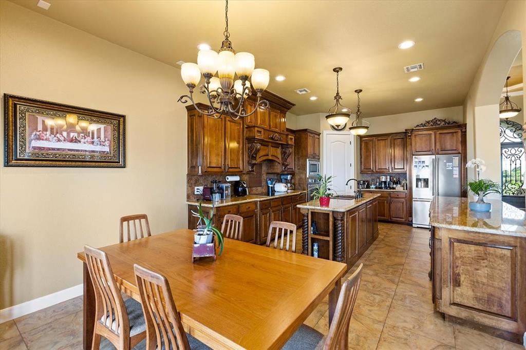 Large Breakfast Room With Upscale Light Fixture*You Can Even Use A Larger Table Than The One That Is Being Used.