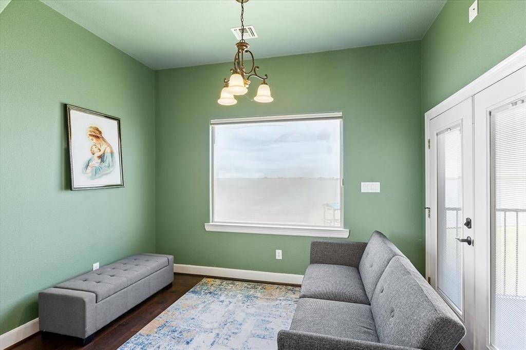 Sitting Area Connected To Primary Bedroom*Upgraded Light Fixture*Double French Doors Opening To Balcony.