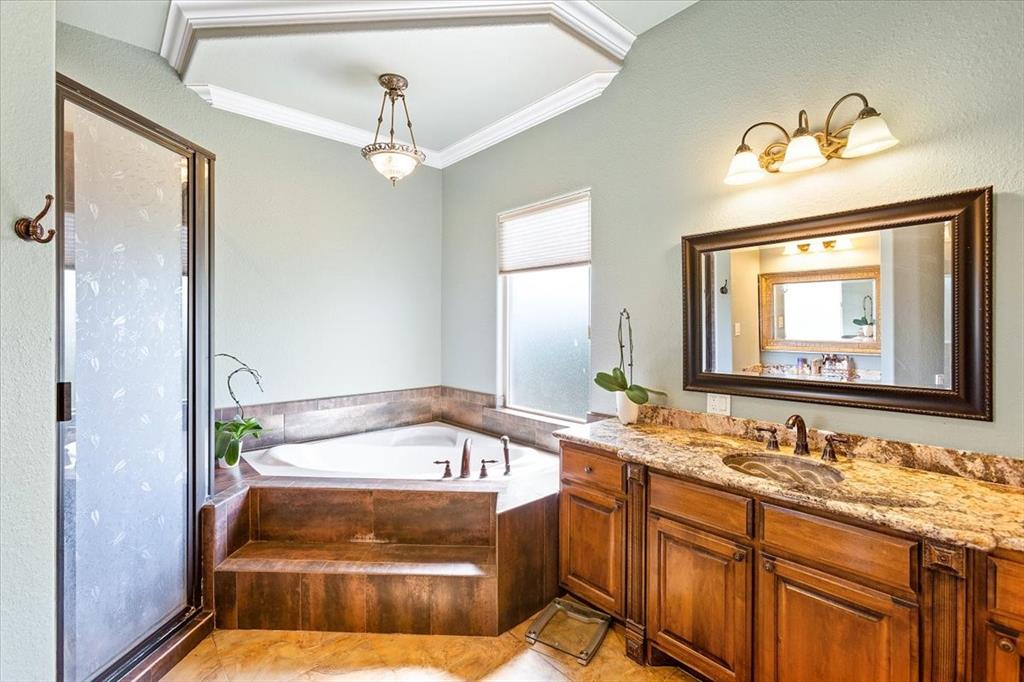 Primary Bath With Double Vanities*Under Mount Sinks*Bronze Faucets*Whirlpool Tub & Separate Shower.