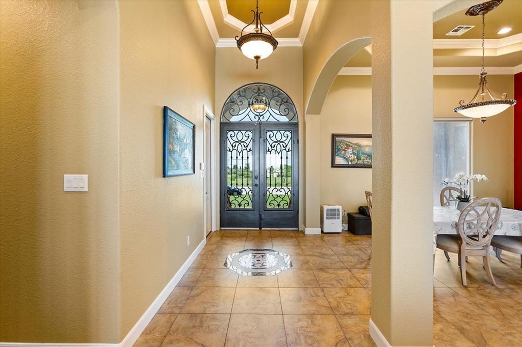 Grand Entry With Double Tray Ceiling*Arch Double Glass & Metal Doors*Medallion Tile Insert.