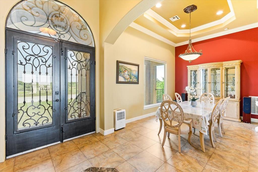Grand Entry With Oversized Front Doors*Formal Dining Room With Double Tray Ceiling*Upgraded Light Fixture.