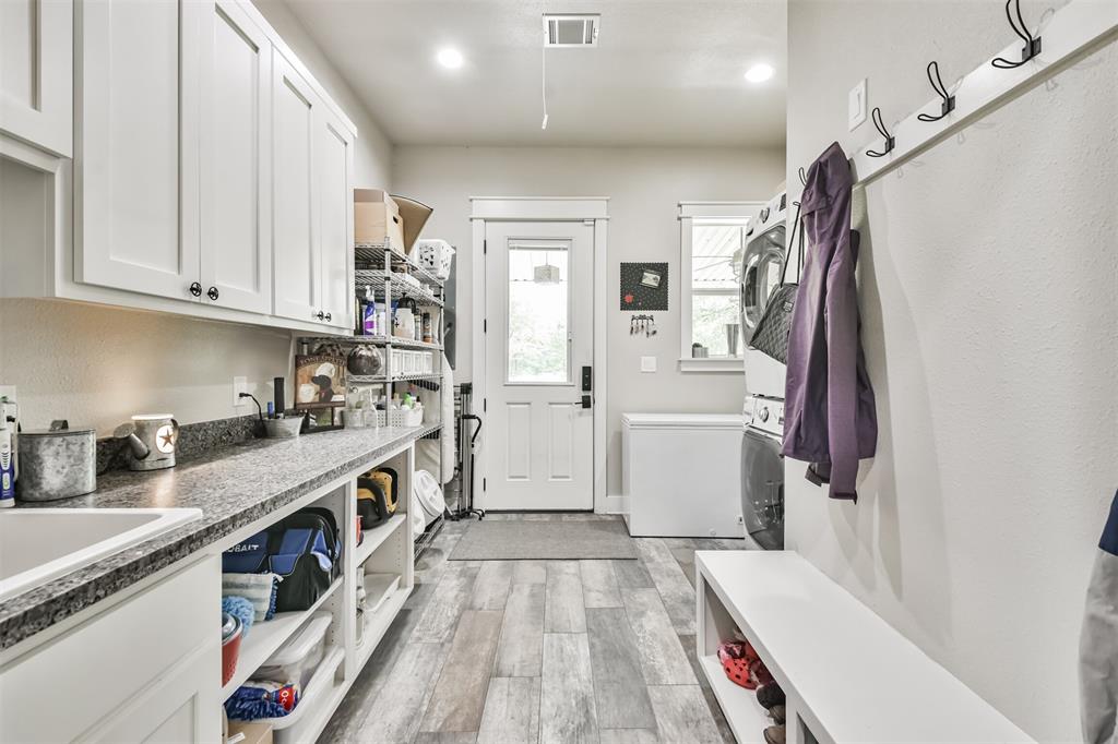 Large laundry room with tons of storage.