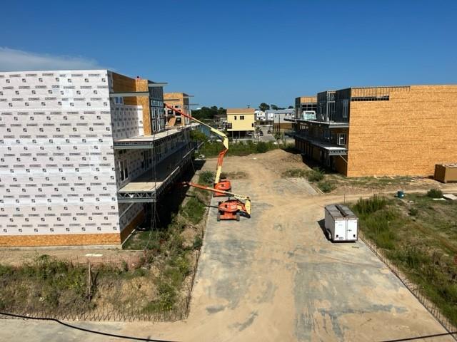 The beginning stages of the man made swim lake. There will be a beached entry on both sides.