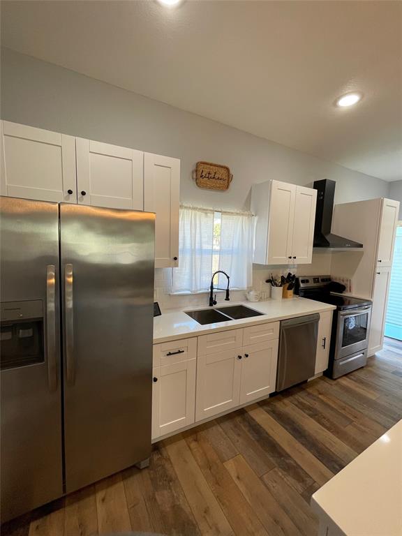 Recent cabinets, sink, sprayer faucet and included stainless steel appliances.  Refrigerator with ice maker and water dispenser is included