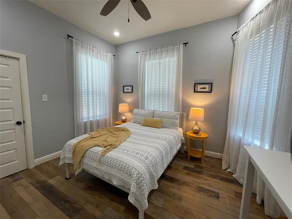 Bedroom #2 features a queen bed which sleeps 2. Three windows offer lots of natural light