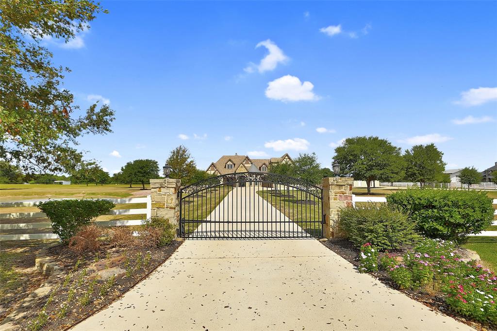This house has a gated entrance for extra privacy! Plenty of room to roam on this large acreage property!