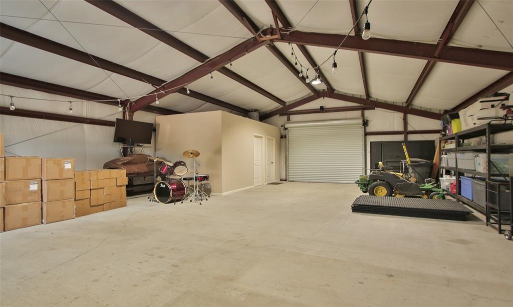 Inside the barn which is fully insulated, has an office and a convenient full bath. Plenty of room for cars and much more.