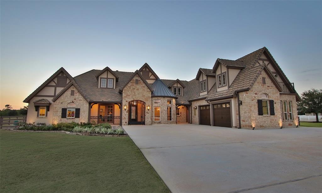 Gorgeous curb appeal with this house. Two car garage to the left and a gated courtyard.