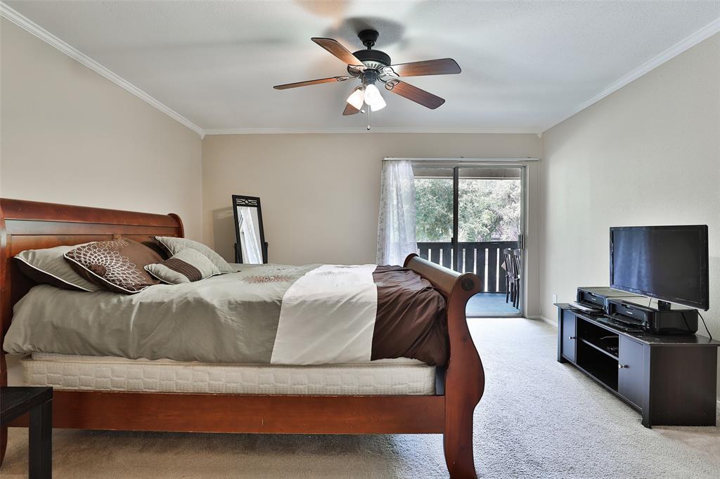Spacious primary bedroom.  Also features sliding patio doors that lead to your back balcony!