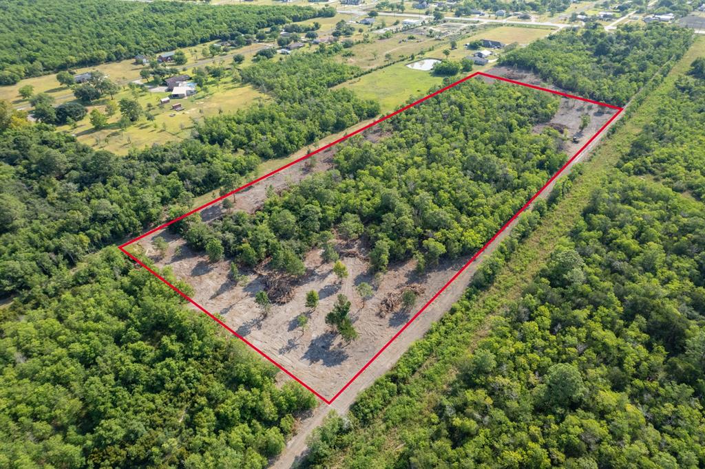 This property boasts almost 10 beautiful acres in a very sought after school district, close to FM 2354. Easy access to 99 and could be used for your forever home or a commercial property. A private landing strip near by and close proximity to Trinity bay. A documented easement is used to gain access, again that is documented with a hard road.  Considering this property is unrestricted the options are limitless. Large home with animals? SURE! Barndo? SURE! Warehouse for your business? YUP! If you need nice acreage that doesn't flood in a good location then come check this one out.

Outlines and all other measurements are approximate. 9.92 acres total per lot according to CAD and plat, 2 lots are available.