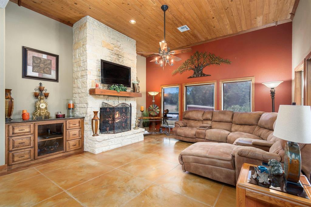 FAMILY ROOM OFF KITCHEN WITH GAS START AUSTIN STONE FIREPLACE