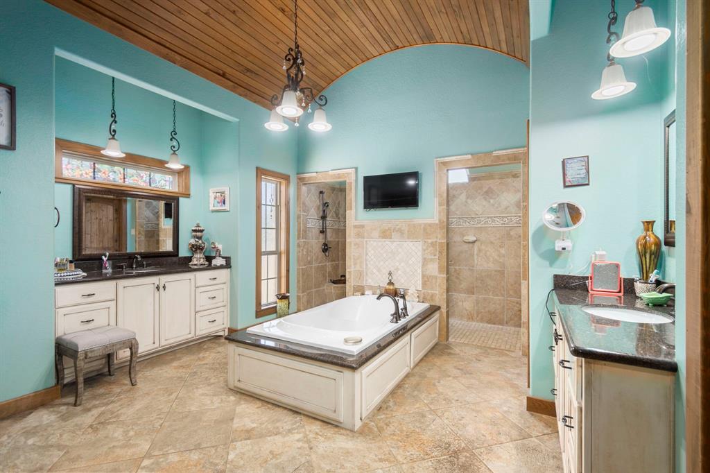 MASTER BATHROOM WITH WALK THROUGH SHOWER, SOAKING TUB AND HIS-HER SINKS