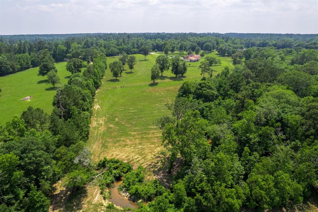 AERIAL VIEW OF CREEK CENTER OF PROPERTY LOCATION. IN THIS LOCATION YOU CAN DRIVE THROUGH CREEK ON TOP OF RIVER ROCK.