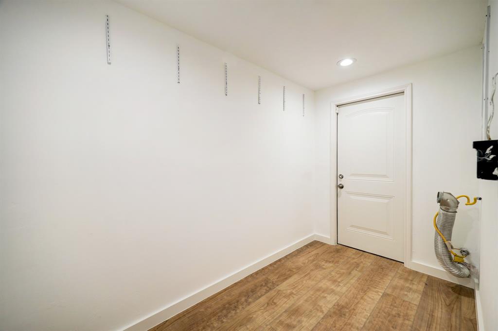 Do not miss the utility room...so spacious.  This door leads to the garage where you can even add another refrigerator