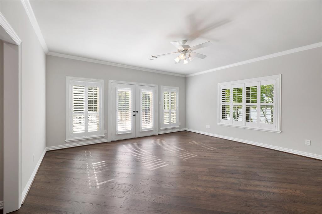 This oversized secondary bedroom upstairs could be a game room.  All bedrooms have plantation shutters and this room has direct access to the balcony!