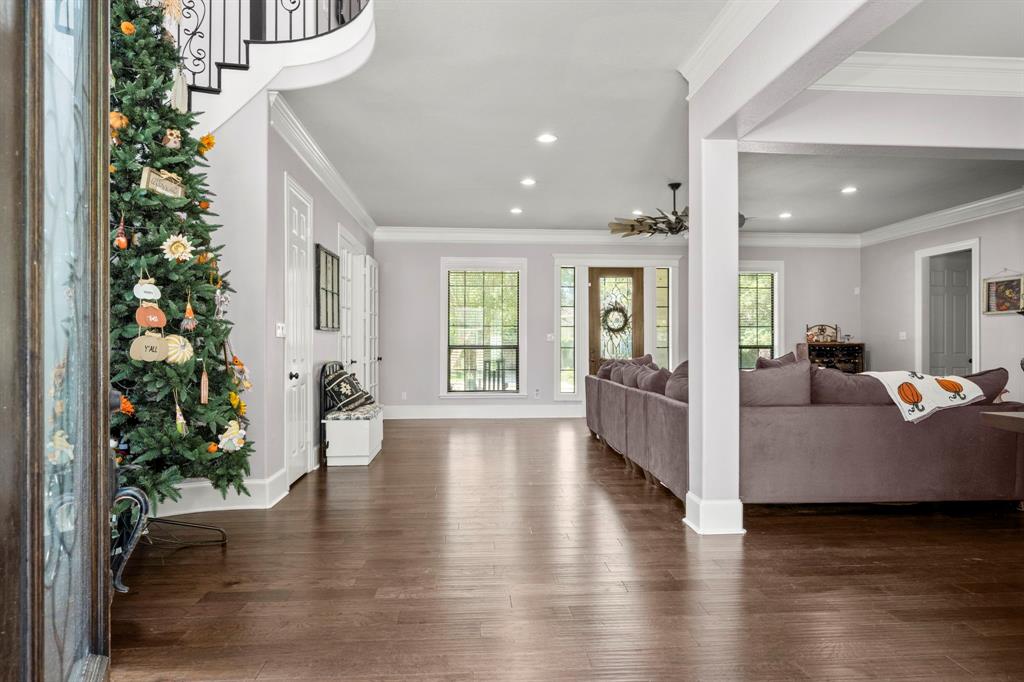 Beautiful Entry. Gorgeous Hand Scraped Wood Floors Thru Living & Dining Rooms & Kitchen. Lots of Room to Entertain Here.