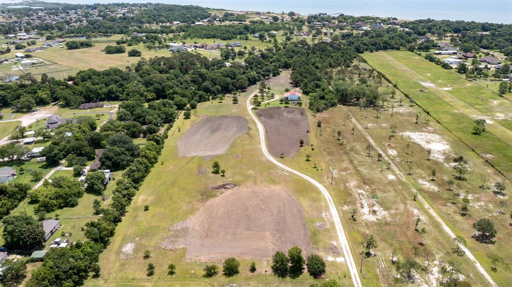 Approximately 800 loads of dirt were brought in by sellers to level and fill low this beautiful property with private road.