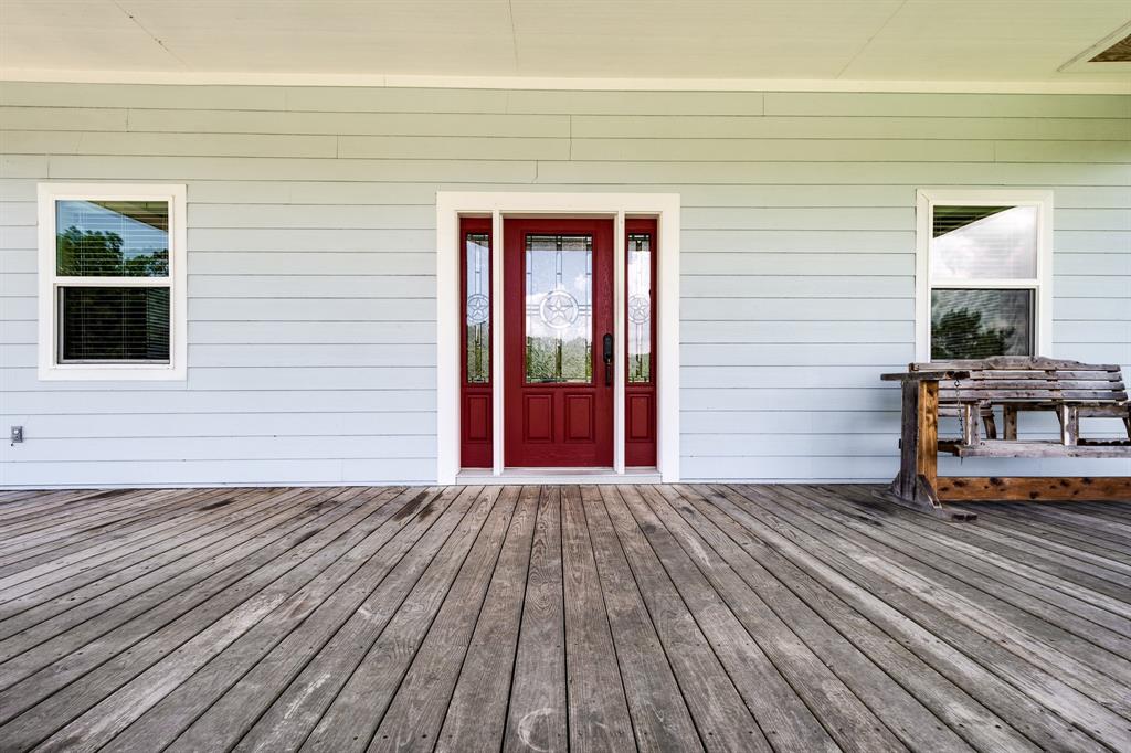Warm & welcoming entrance with this happy red door entry leading into this well-built home.  Home was constructed with 2x6 exterior walls, and built to windstorm specifications.