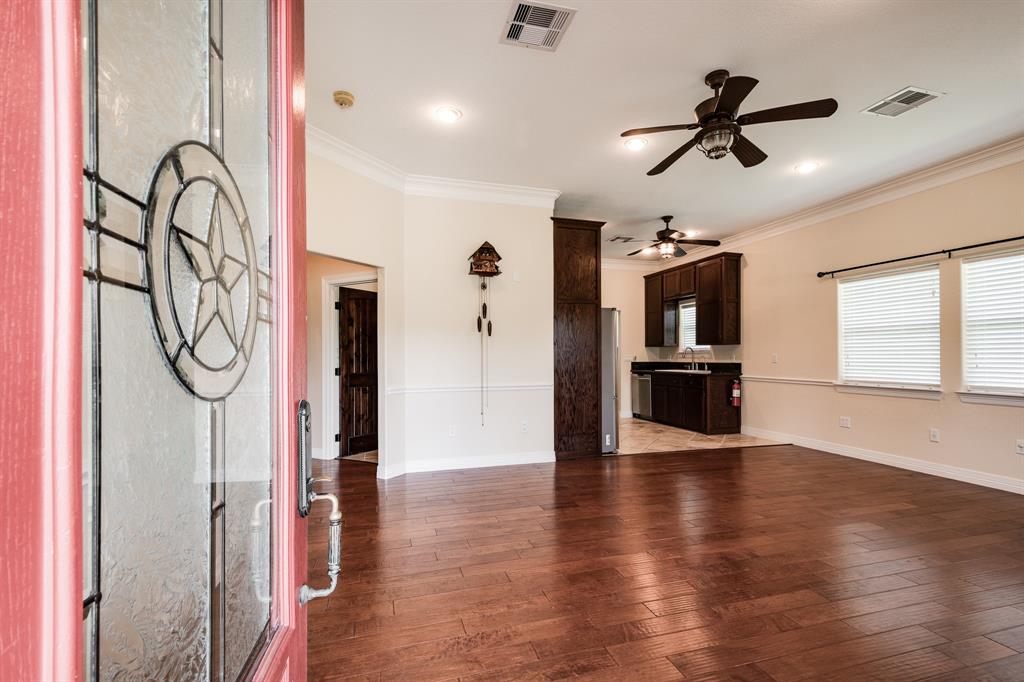 Upon entry you see the gorgeous hand-scraped wood floors in this large living area.