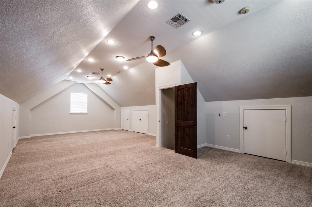 Fantastic upstairs gameroom measures approximately 17X34.  Room has Lots of built-in storage options, added carpeting for soundproofing, a door that closes this room off for additional privacy and soundproofing.