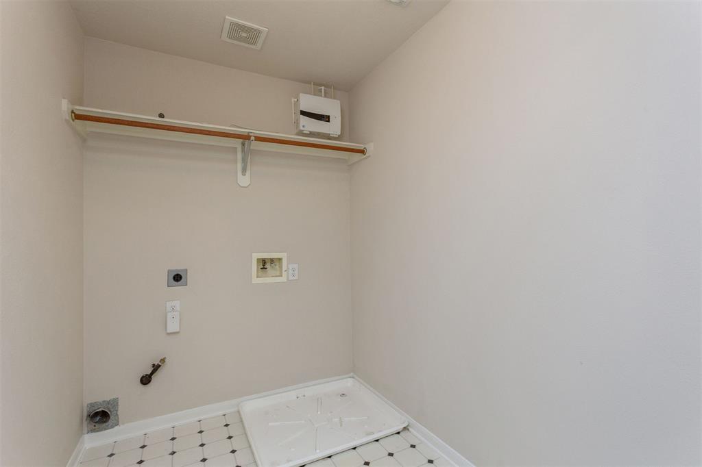 The upstairs laundry room that is conveniently located by all 4 upstairs bedrooms. This laundry room also comes with electric and gas dryer connections.