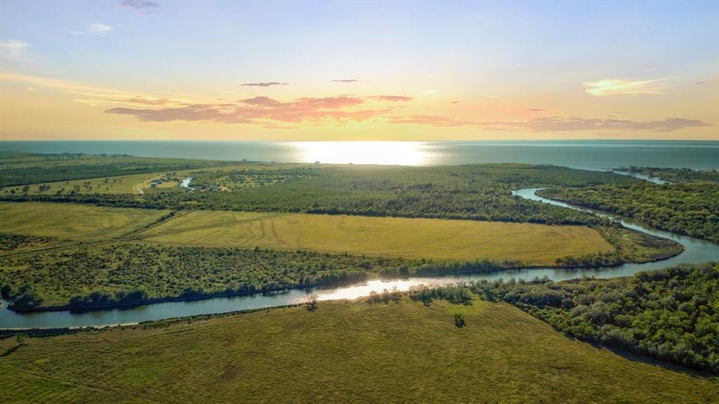 Nestled on the East fork of Double Bayou, with approximately 2,873+/- feet, at North boundary, of waterfront! One-of-a-kind tributary that flows to Trinity Bay allowing the best fishing with its brackish water! Just wait until you take a boat ride along the bayou and even out to the open water of the bay! Unrestricted and ag exempt! There is a unlimited amount of opportunities for this property, it is just waiting on you!