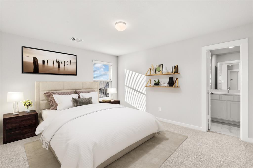 Secondary bedroom features plush carpet, custom paint, large window with privacy blinds and access to a private bath.