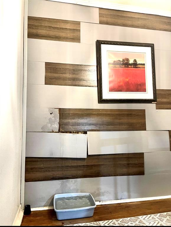 Water damage on the inside wall going up the stairs.