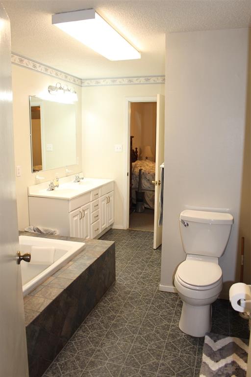 Primary Bath, Jetted Tub, Separate shower, and double sinks.