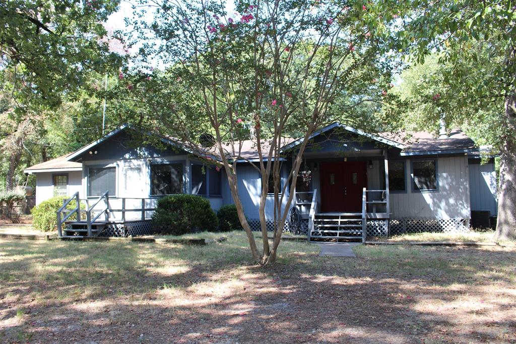 4 Bedroom 2 Bath, Split floor plan home, nestled among towering mature trees resting on 1.83 acres, with-in walking distance of marina and boat ramp.