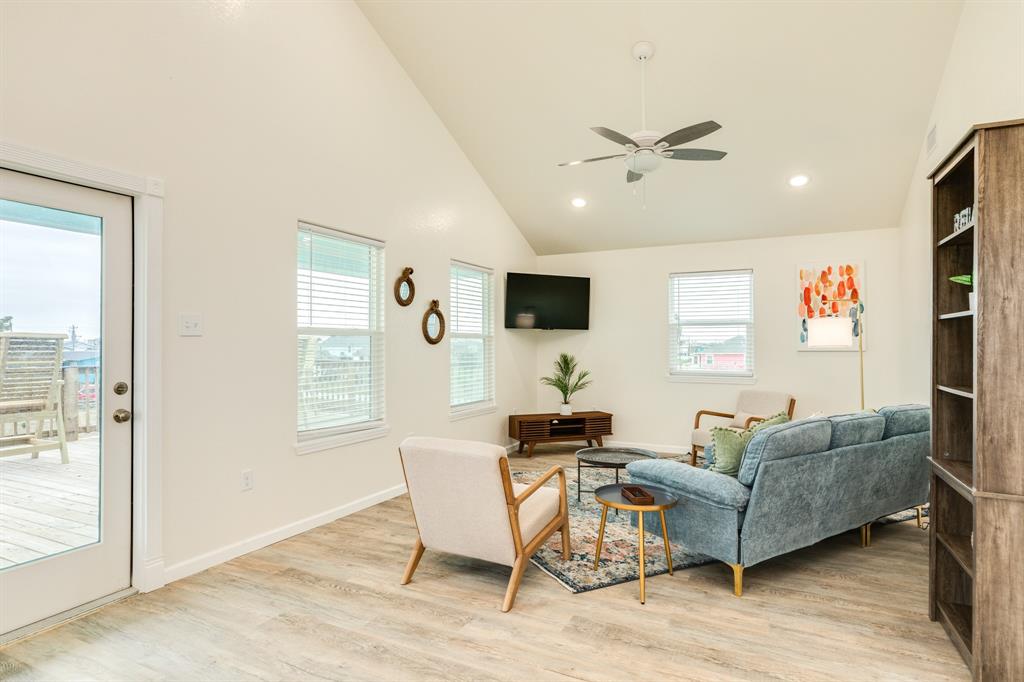 The open living area with vaulted ceilings is to your left