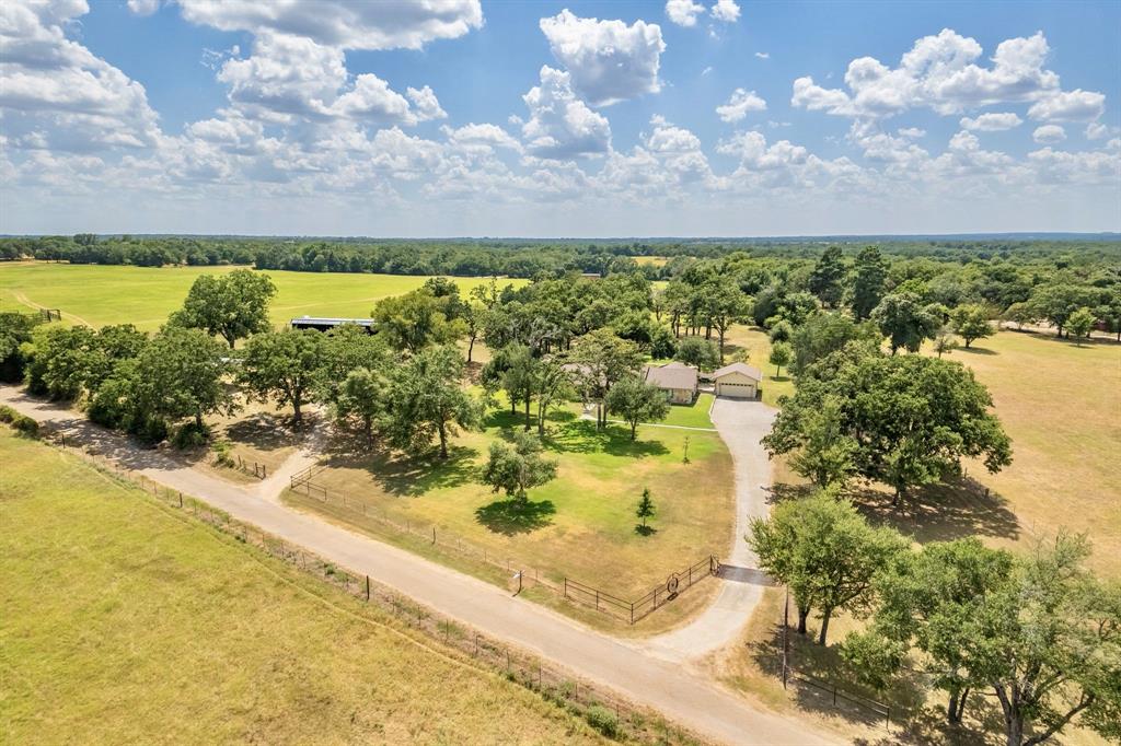 An hour from Austin/College Station, 20 min. from Caldwell/Giddings/Rockdale and 10 min. from Lexington in Nalley!
34+ acre Big Cock Ranch, fronts FM 696 E, joins 100 acre Disparity Ranch and runs more than half way down
the west side of CR 406. The combined properties offer more than 134 acres of meticulously kept, gently rolling/improved prairie land w/thickets of hard woods scattered throughout and features; scenic rural views, 
a hill tucked away from the road w/spectacular views and THE PERFECT BUILDING SPOT for a second home, 
a mix of pasture/wooded areas with lots of wildlife, five cross-fenced pastures of improved grasses for cattle/horses/hay production and four stock tanks. Designed for herd rotation, with Lee Co. Water piped to each cross-fenced pasture, gates for easy herd movement and cattle guards between each pasture. Two set of cattle pens, a 30'x40' metal barn w/shop/RV storage, 30'x60' equipment shed and a 3/3 - 2,438 sqft. Austin Stone home w/ detached garage.