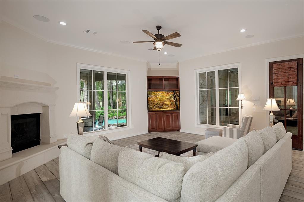 This family room has a fireplace and door leading to the screened in patio