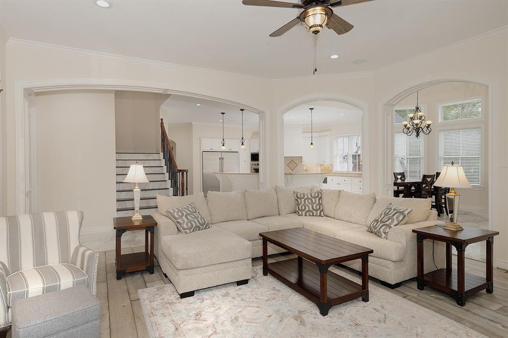 A 2nd staircase is featured in this photo off the family room and kitchen