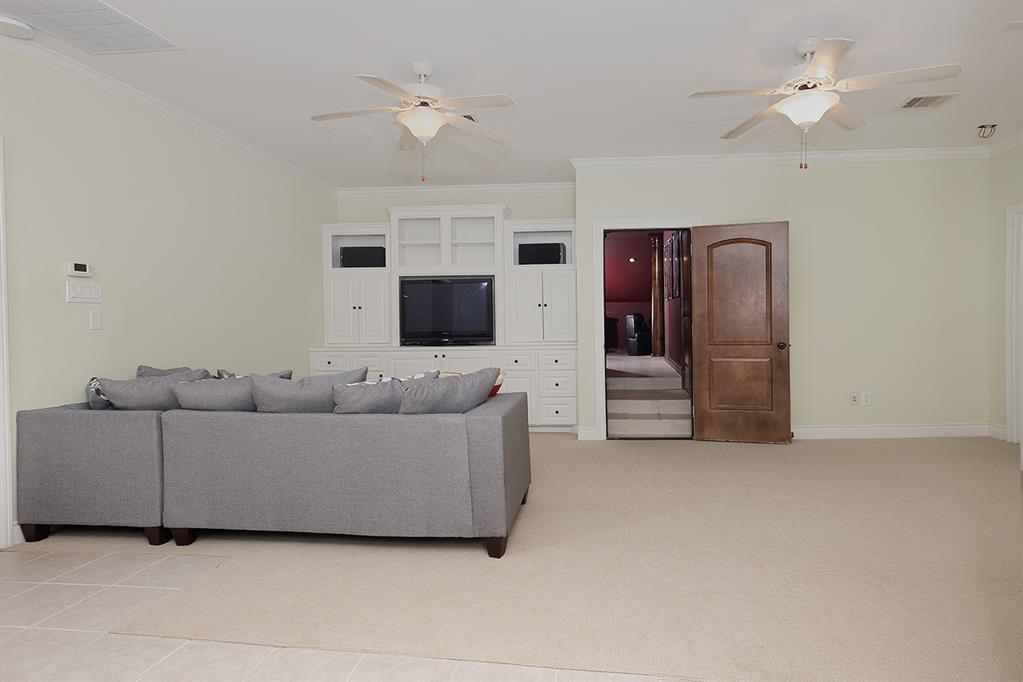 This 3rd floor living area with built-ins off the media room has an adjacent kitchenette
