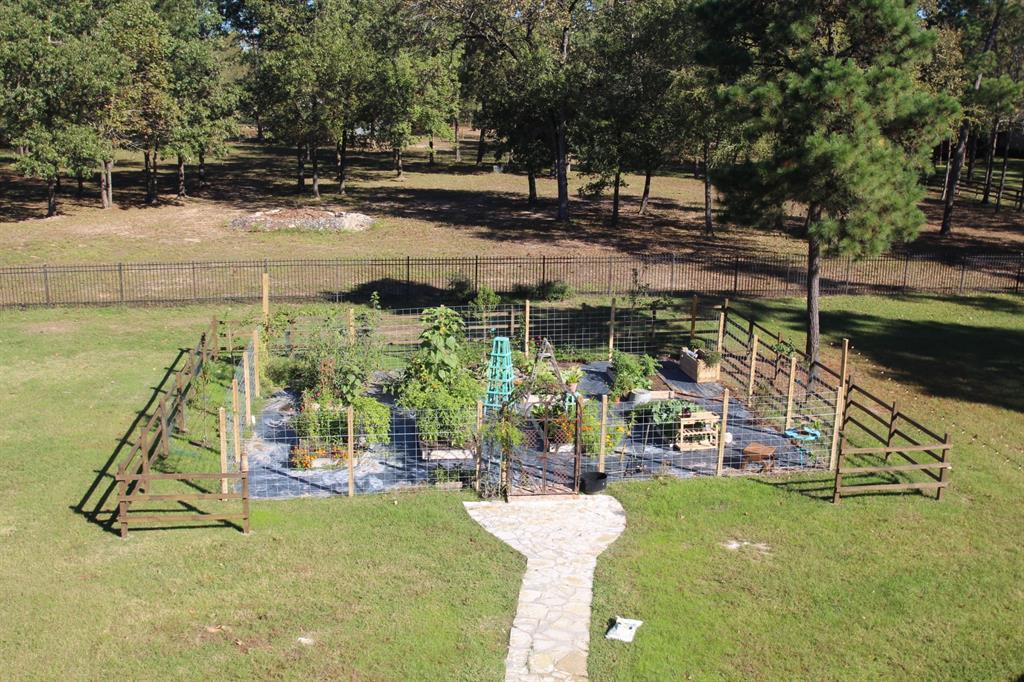 Fenced vegetable garden, seen here from the ante-room of the primary suite.