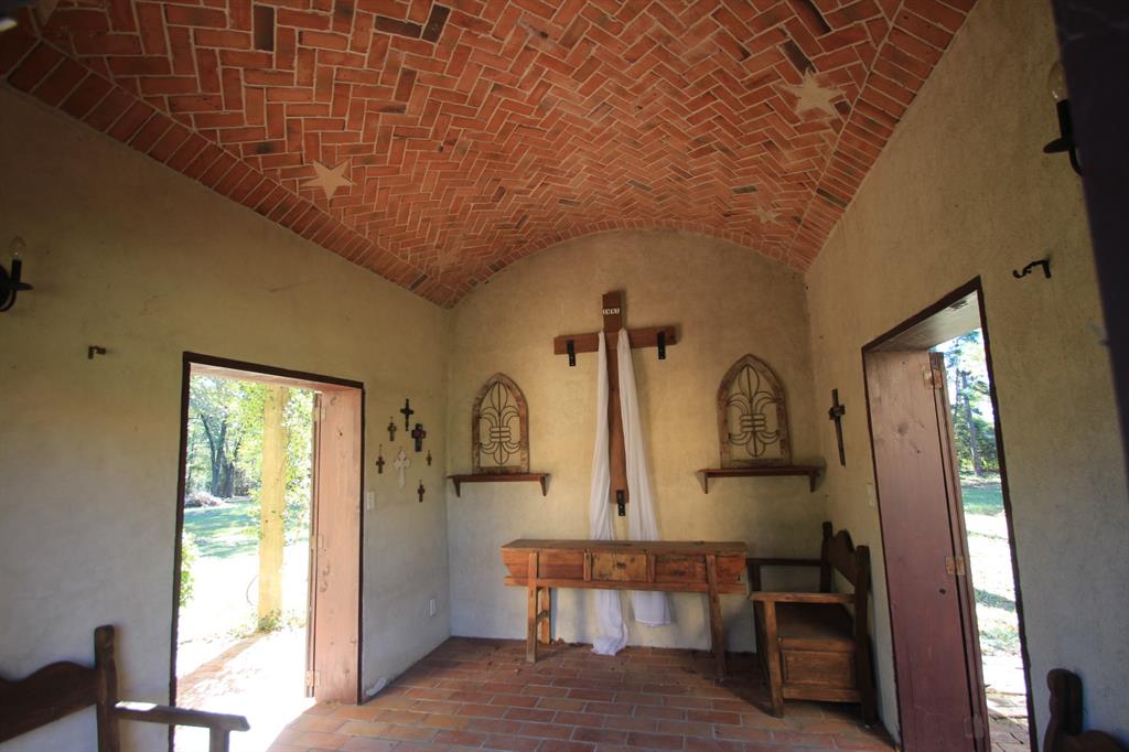 Interior of the chapel has a brick barrel vaulted ceiling.