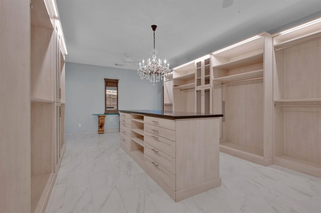 WOW! Completely custom closet with luxury finishes. Customizable shelving and hanging rods for differing length clothing, custom shelving to display all your shoes/purses/clothes in sight, multiple mirrors — just to name a few. Truly a “Must See”