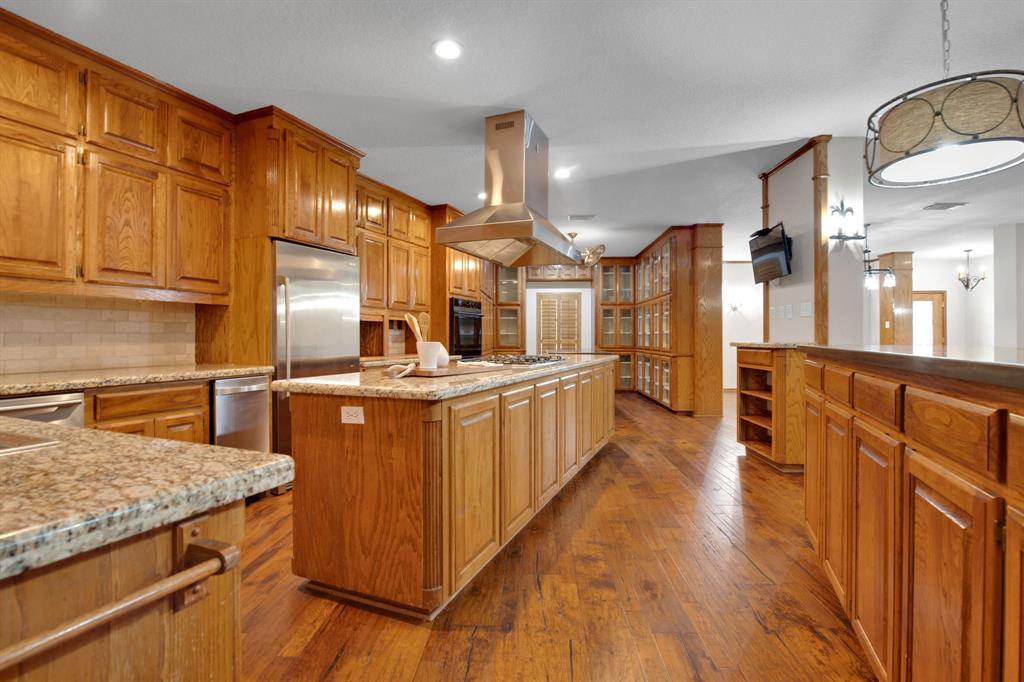 Beautiful kitchen with TONS of storage and prep space within the three separate islands & wall to wall cabinetry.