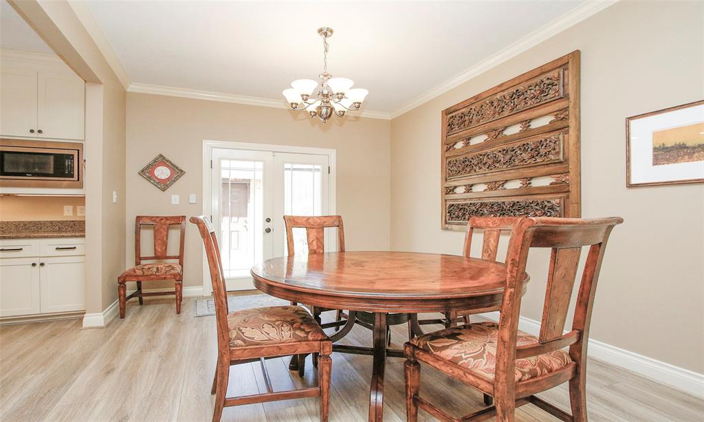 From the family room you easily transition to the dining room with French doors providing additional natural lighting.