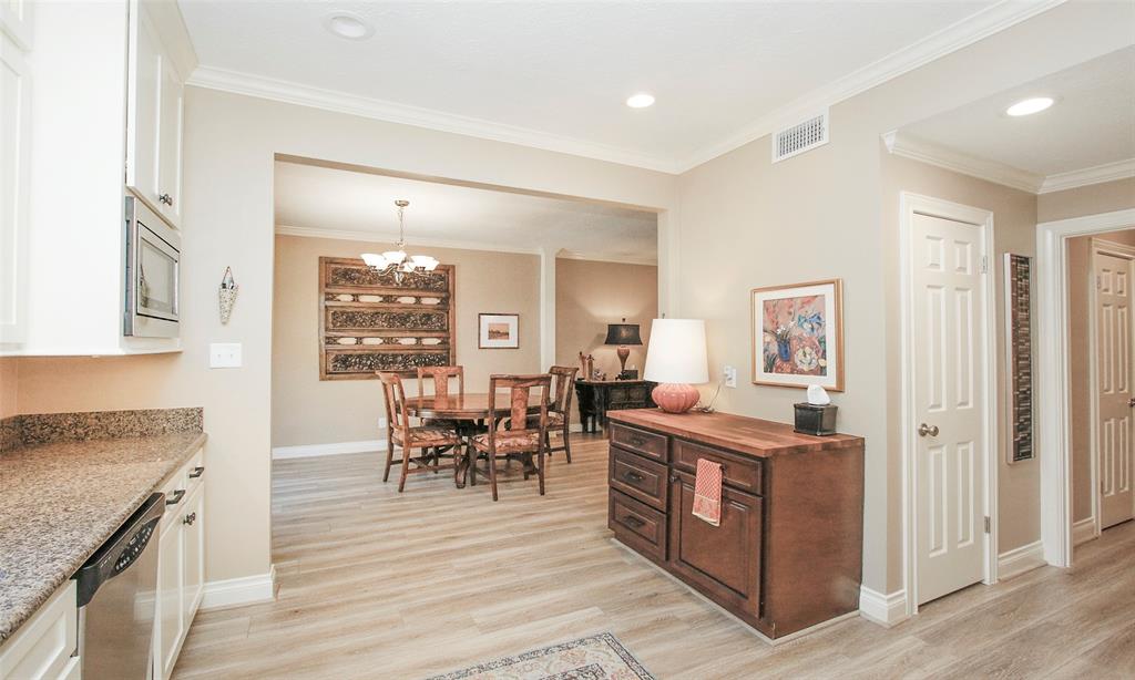 Beautiful built in wooden cabinet serves as a great serving area from kitchen to dining room.
