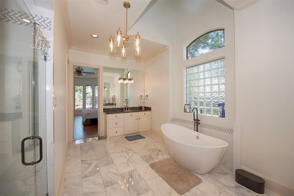 The bath includes a separate walk-in shower and oversized double closets.