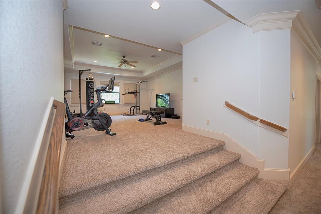 Upstairs is an elevated game room (currently used as an exercise venue) and 3 bedrooms (1 with ensuite).