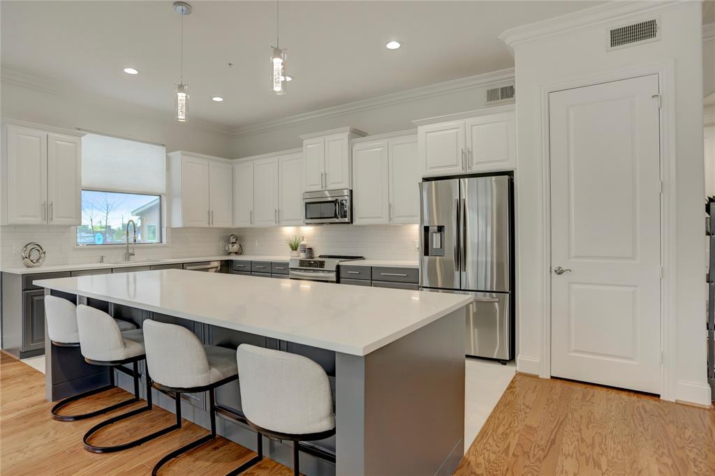 Not to be overlooked is the large walk-in pantry only adding convenience to this stylish, upgraded kitchen.