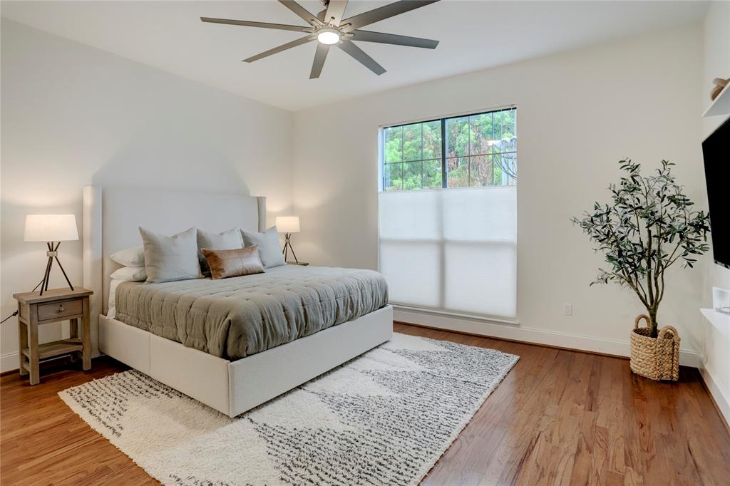 This bedroom again features fan w/light kit and plenty of natural lighting with the large window.