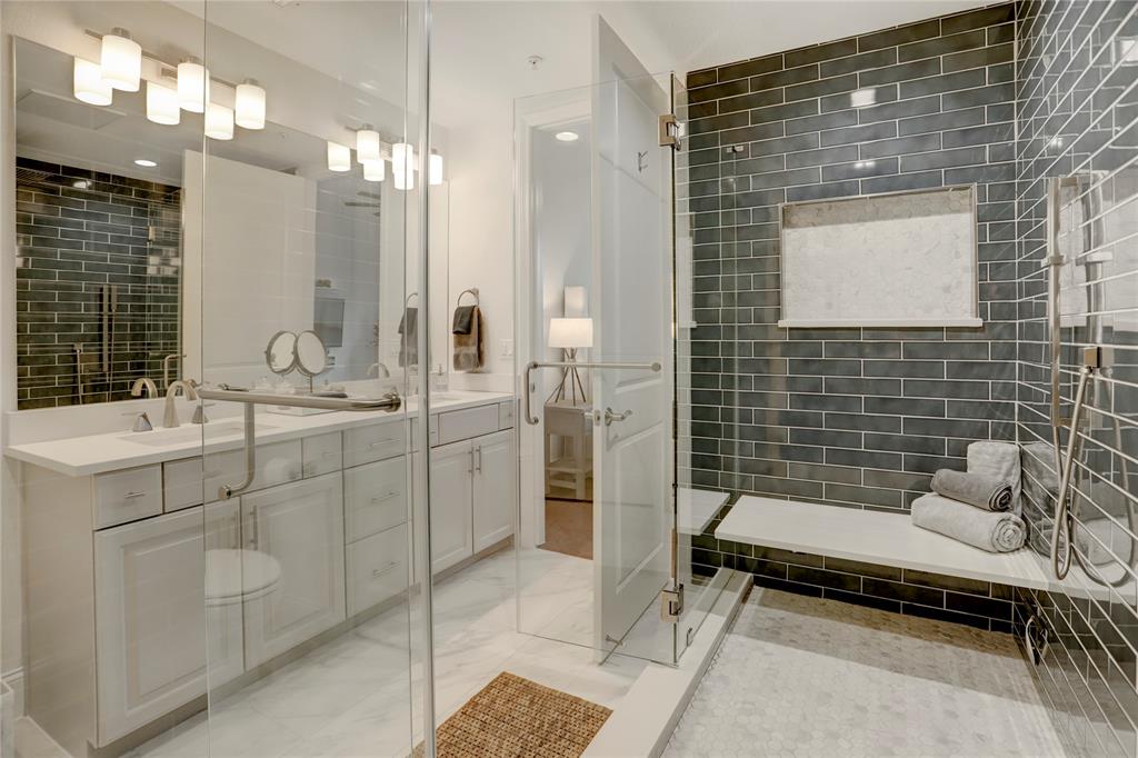 HOLY shower? Can you believe the size of this amazing shower. With upgraded subway tile surround and bench seat, this shower exudes luxury and creates the perfect relaxing ambiance.
