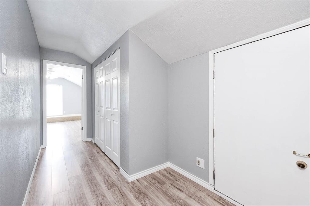 LARGE HALLWAY LEADS TO BEDROOM 4 UPSTAIRS.