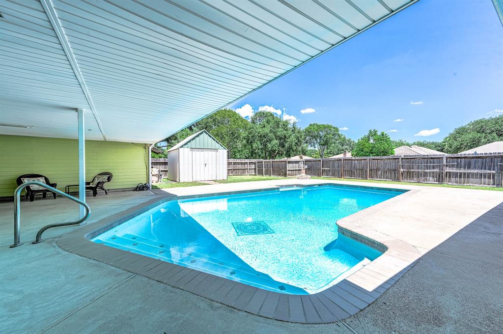 PRISTINE SWIMMING POOL IS READY TO BE ENJOYED.  12\' X 12\' STORAGE BUILDING CAN STORE THE POOL AND LAWN EQUIPMENT.
