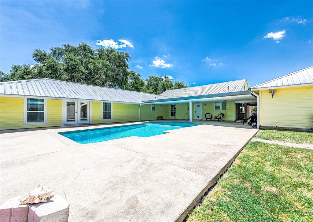 Double doors lead to 1 bedroom, 1 bath, small kitchenette quarters! Easy access from main house and quarters to take a dip in the beautiful pool!